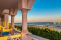 View of the hotelÃ¢â¬â¢s recreation area on the beach and the sea shore, palm trees under the blue sky of a sunny day Royalty Free Stock Photo